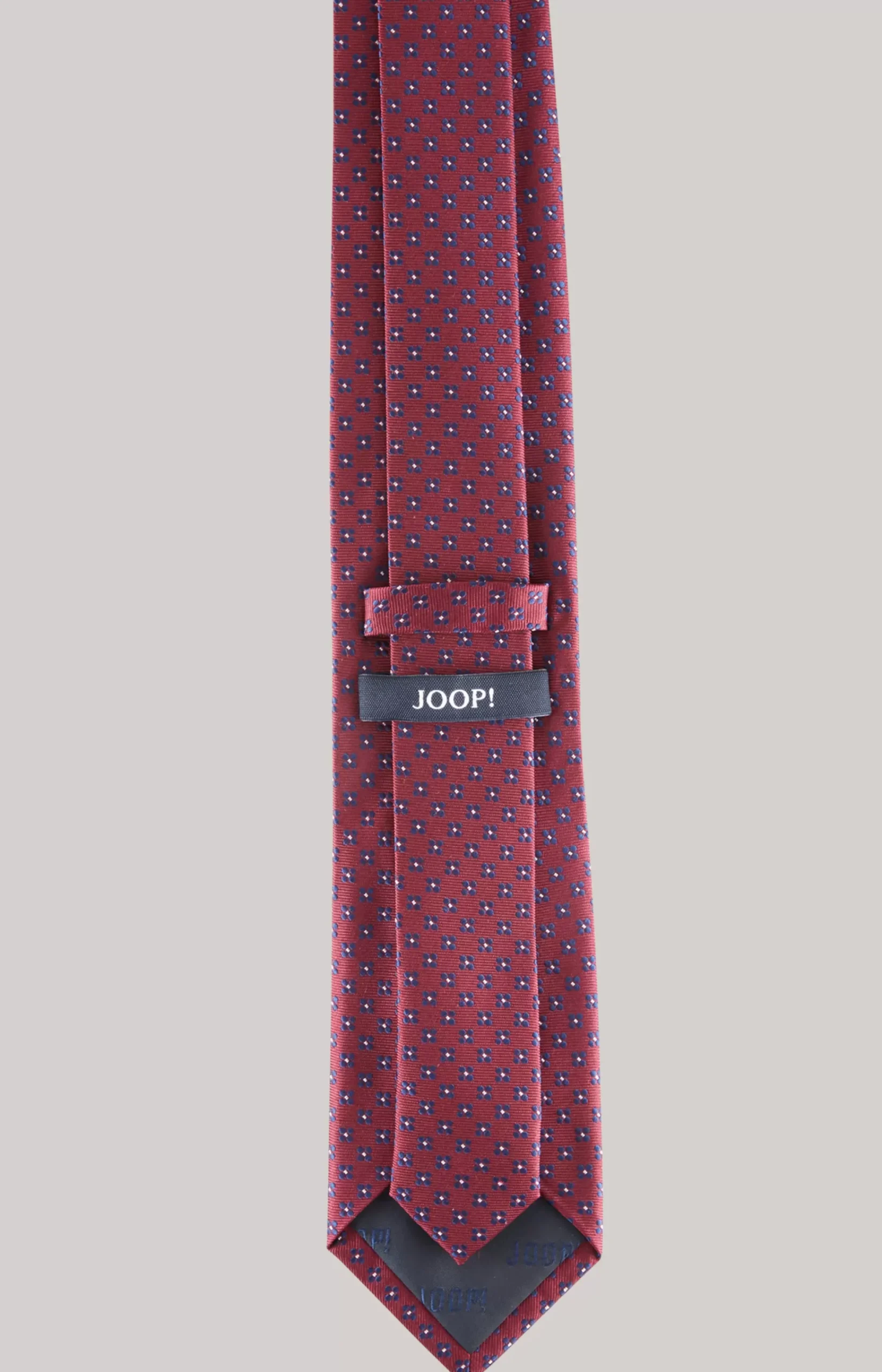 Silk tie in a dark red pattern